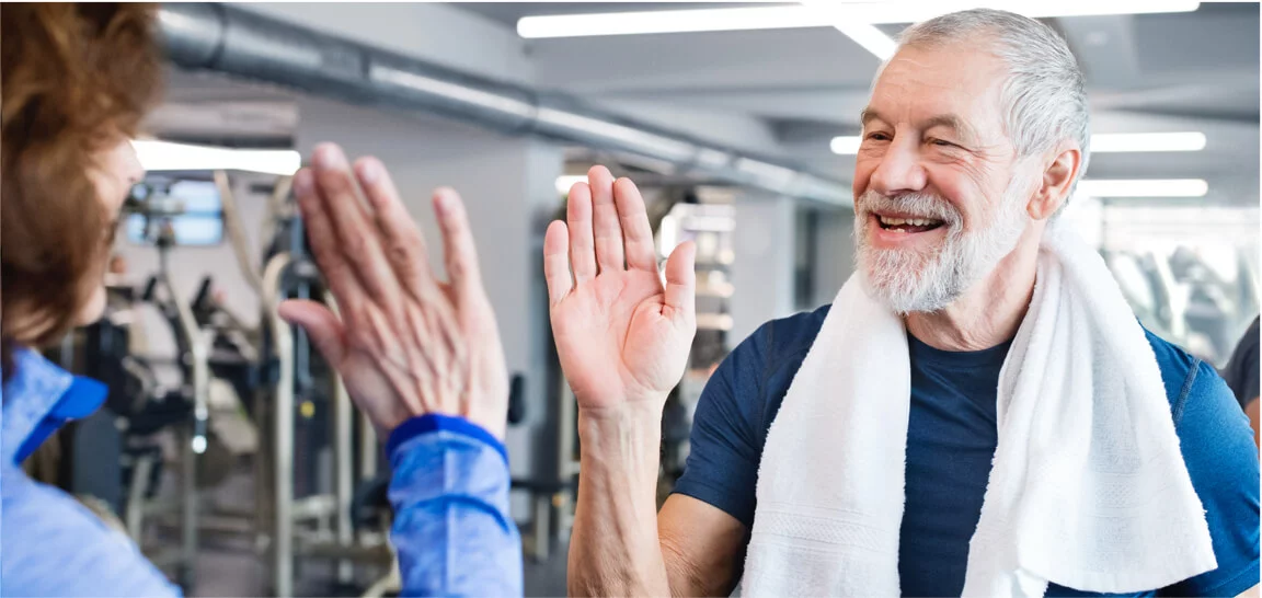 Healthy Senior adults staying fit at gym